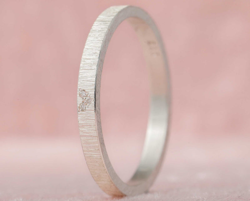 Medium addon in wrinkled silver set with diamonds