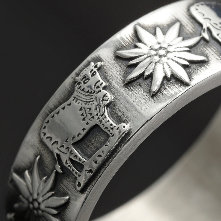 bijou argent 925 avec motifs de vache et fleur edelweiss suisse