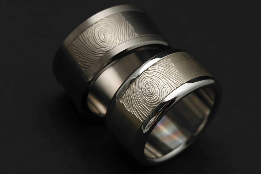 addon argent rings with custom engraved fingerprint design on silver bands